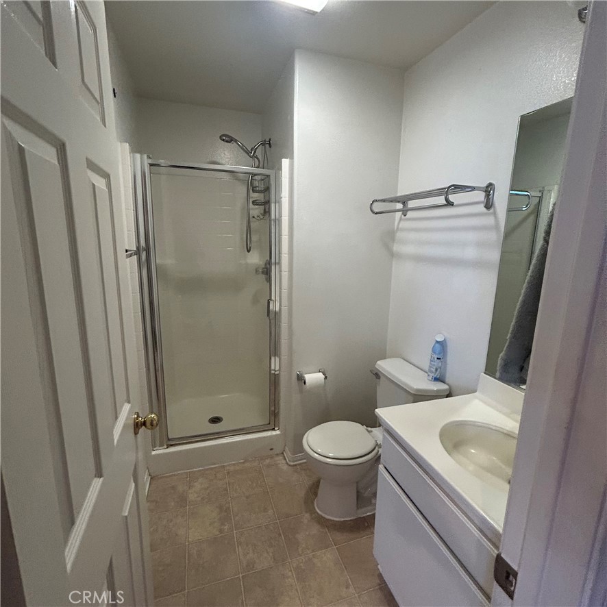1538 Apple Canyon Road Beaumont, CA 92223 - Photo 6 of 23 a bathroom with a granite countertop sink toilet and shower