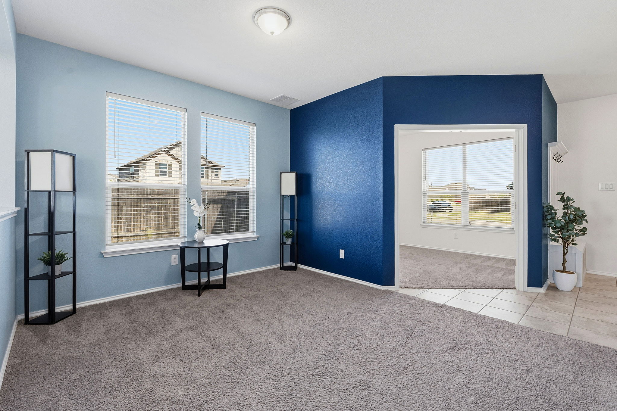 13928 Inaugural Street Manor, TX 78653 - Photo 4 of 34 Dining/play space with study through the opening and front door is on the right.