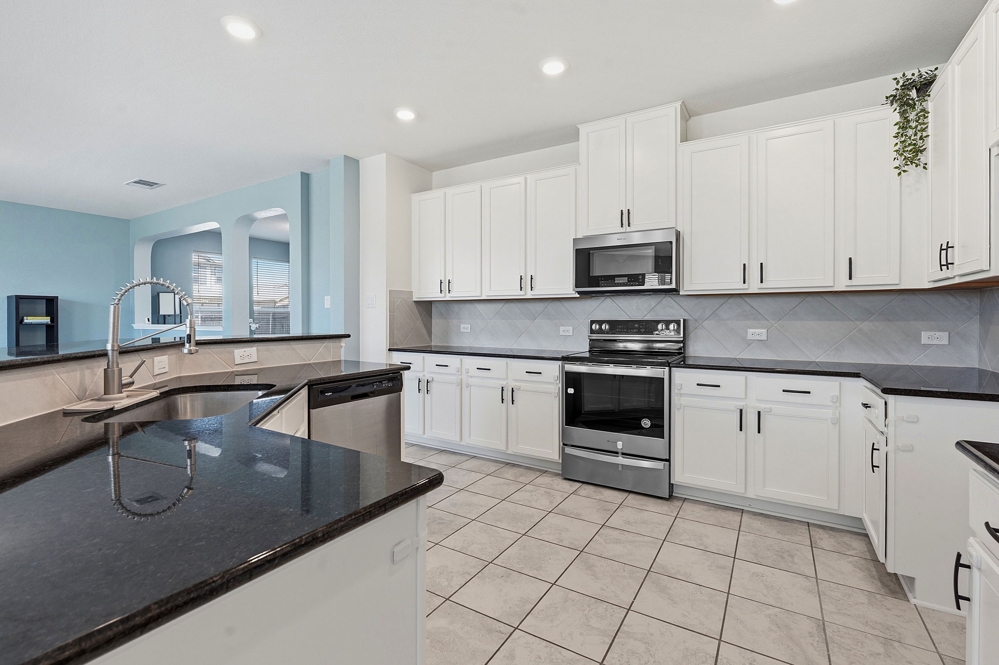 13928 Inaugural Street Manor, TX 78653 - Photo 10 of 34 Open kitchen with a ton of storage.