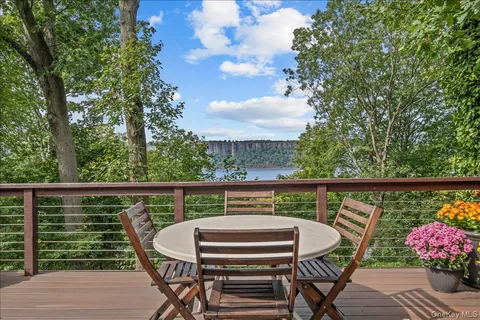 a view of a balcony with furniture