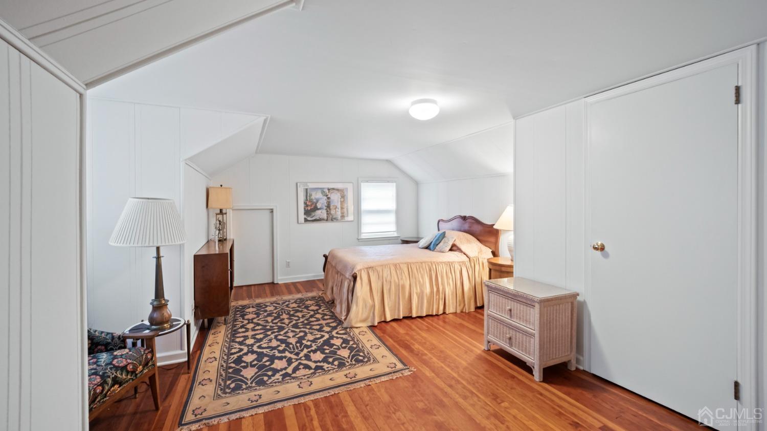 2 Beech Lane Edison, NJ 08820 - Photo 12 of 33 a bedroom with a bed and wooden floor