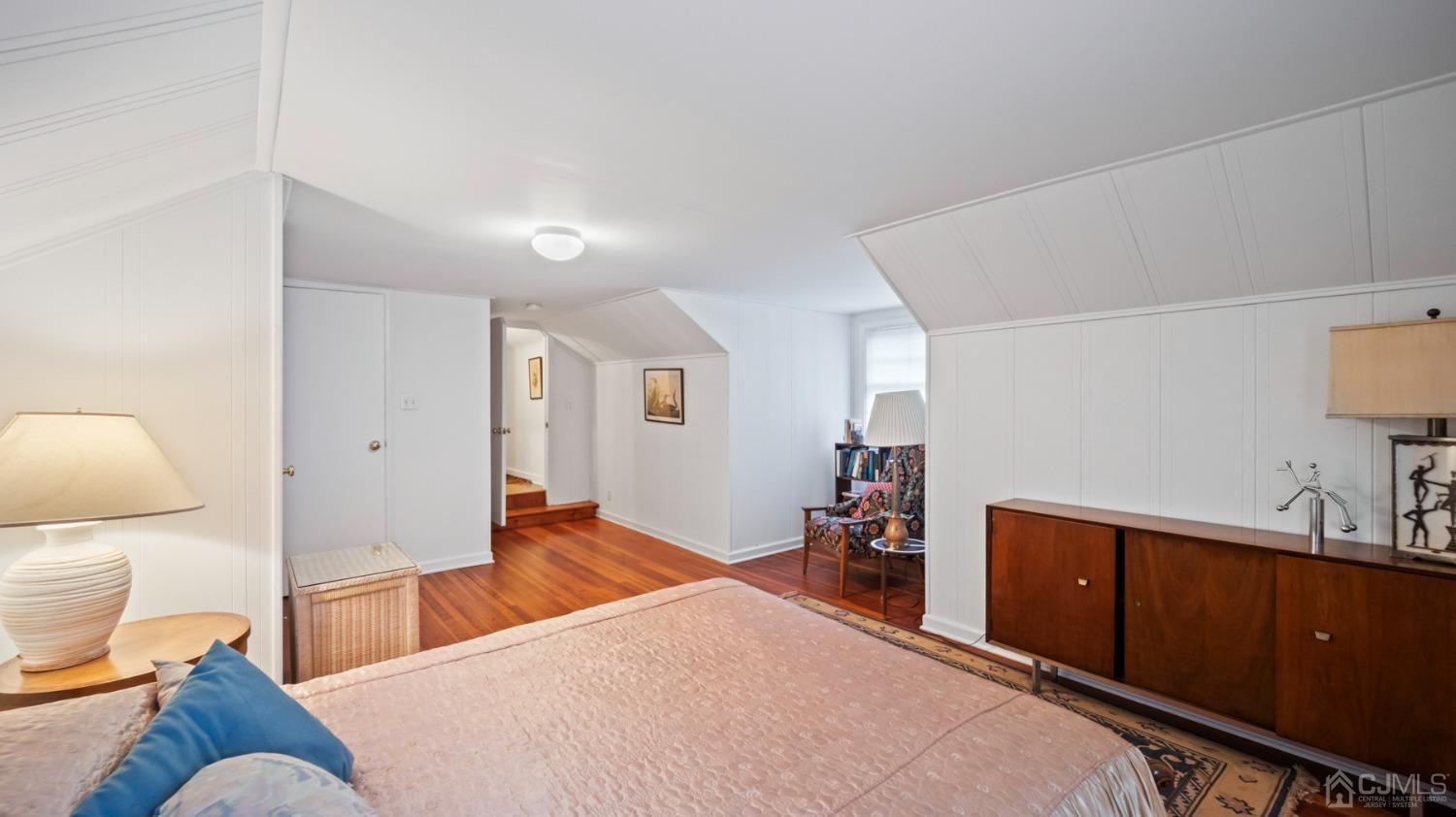 2 Beech Lane Edison, NJ 08820 - Photo 13 of 33 a bedroom with a bed and wooden floor