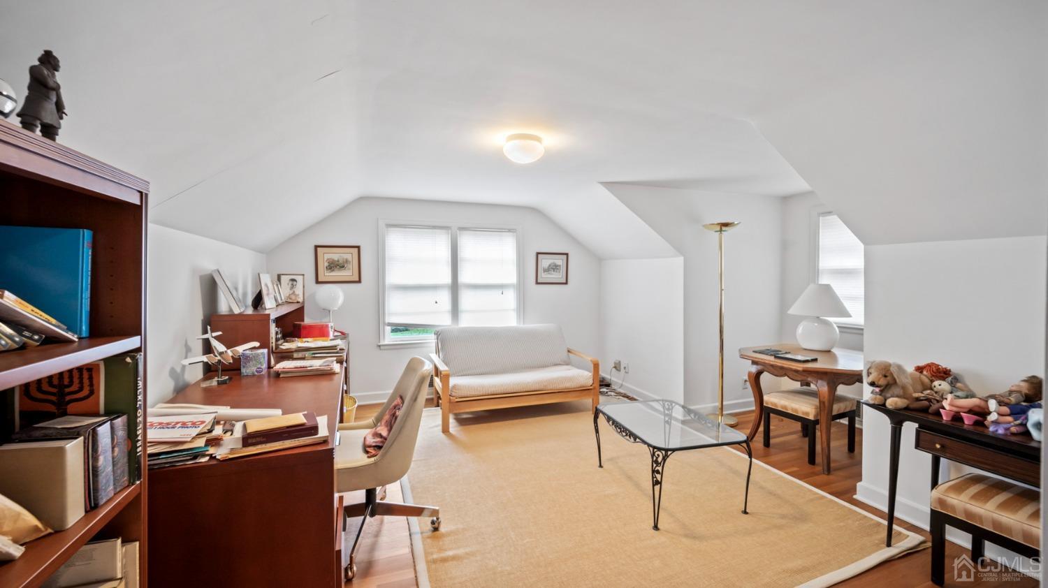 2 Beech Lane Edison, NJ 08820 - Photo 16 of 33 a living room with furniture and a wooden floor