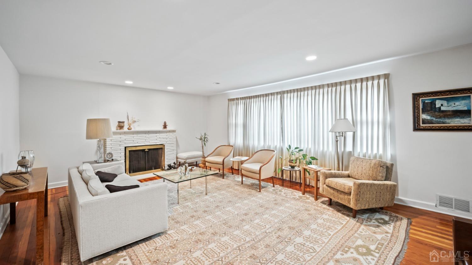 2 Beech Lane Edison, NJ 08820 - Photo 20 of 33 a living room with furniture and a fireplace