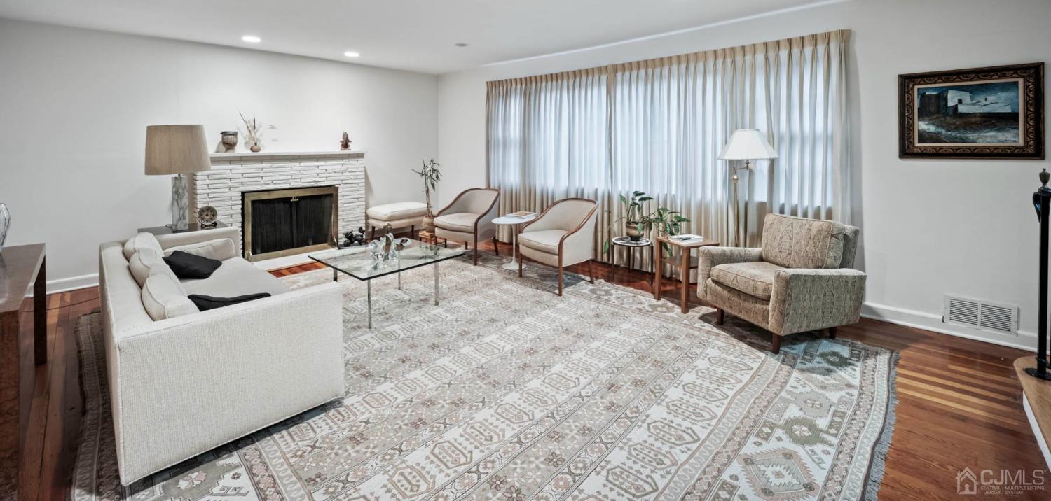 2 Beech Lane Edison, NJ 08820 - Photo 24 of 33 a living room with furniture and a fireplace