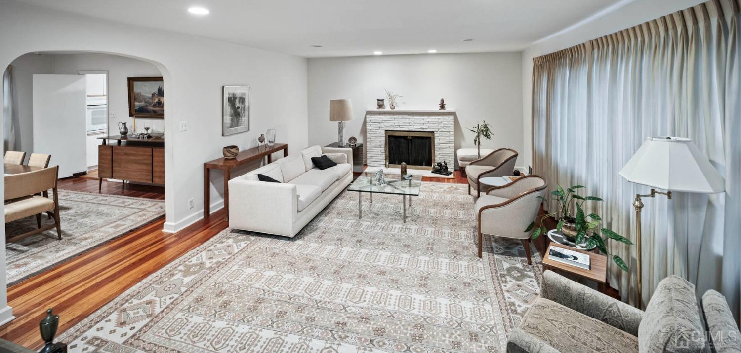 2 Beech Lane Edison, NJ 08820 - Photo 27 of 33 a living room with furniture and a fireplace