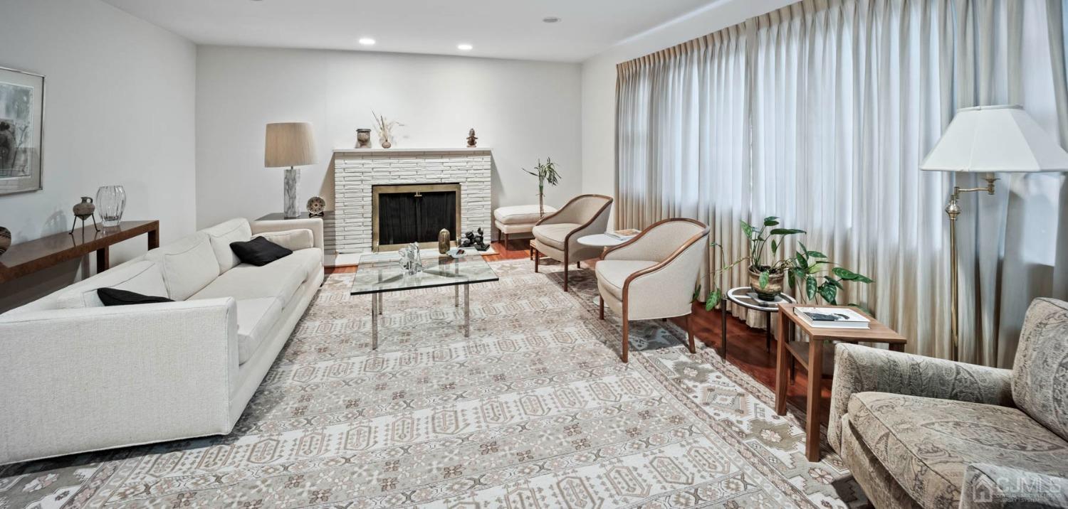 2 Beech Lane Edison, NJ 08820 - Photo 28 of 33 a living room with furniture and a fireplace