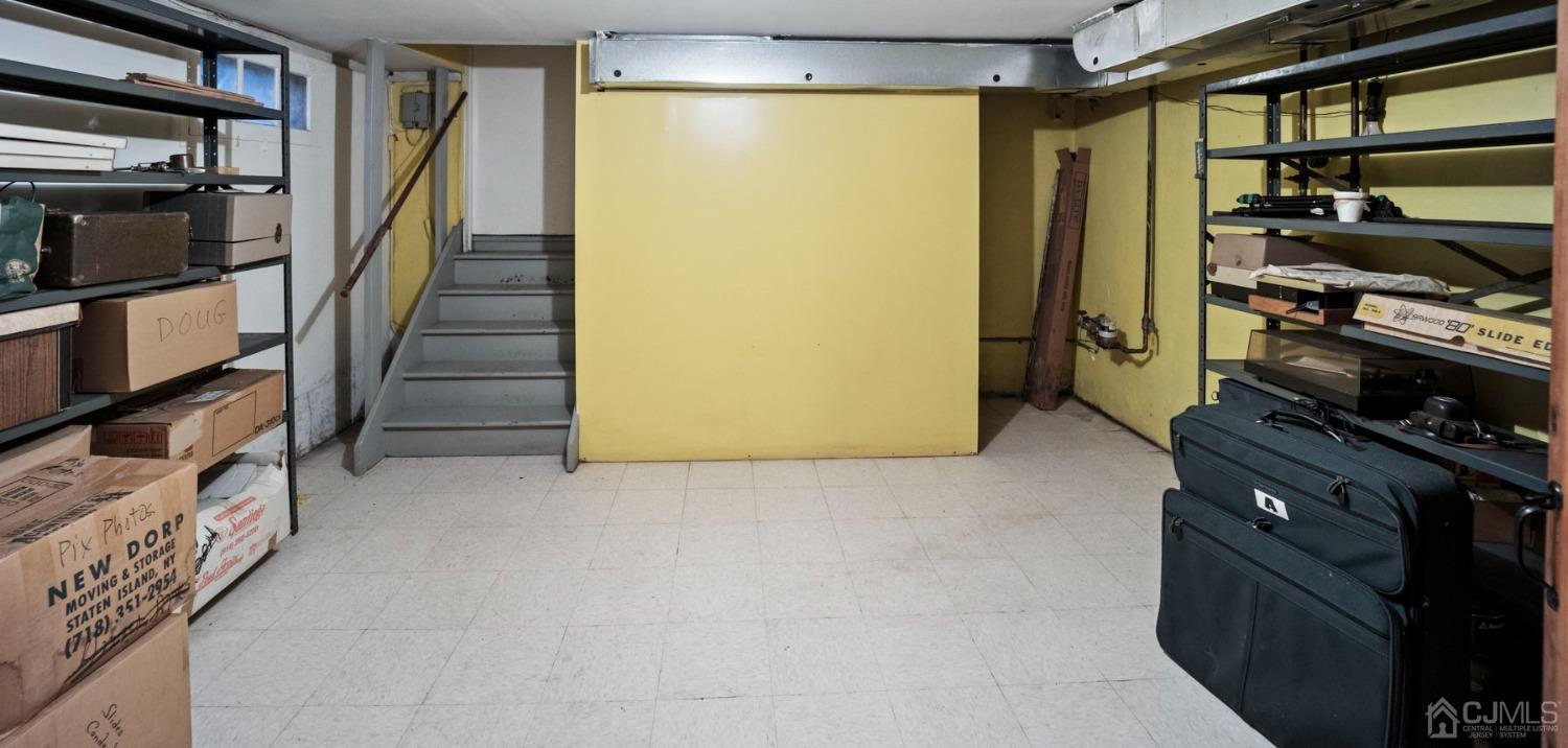 2 Beech Lane Edison, NJ 08820 - Photo 29 of 33 a kitchen with wooden cabinets and a stove top oven