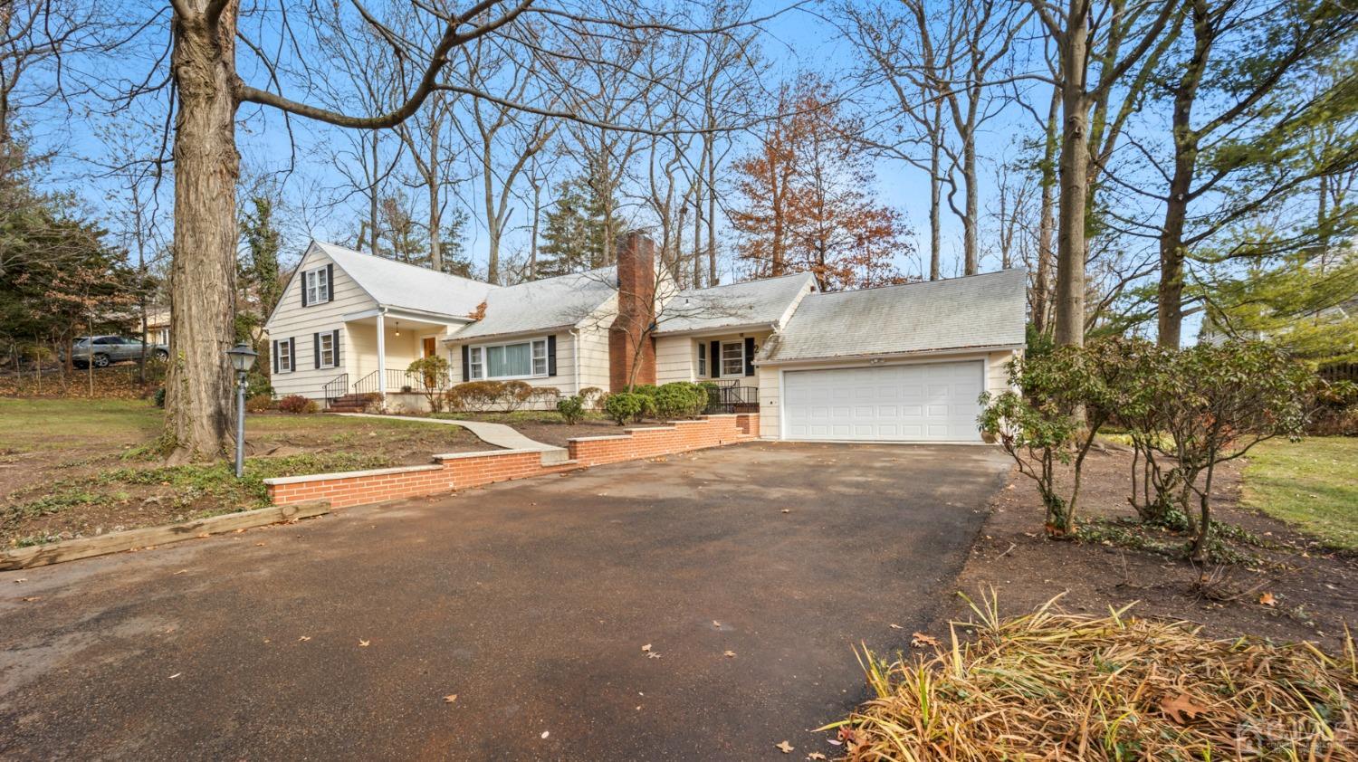 2 Beech Lane Edison, NJ 08820 - Photo 33 of 33 a front view of a house with a yard and garage