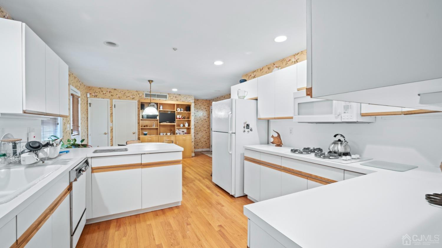 2 Beech Lane Edison, NJ 08820 - Photo 5 of 33 a kitchen that has a sink and a stove in it