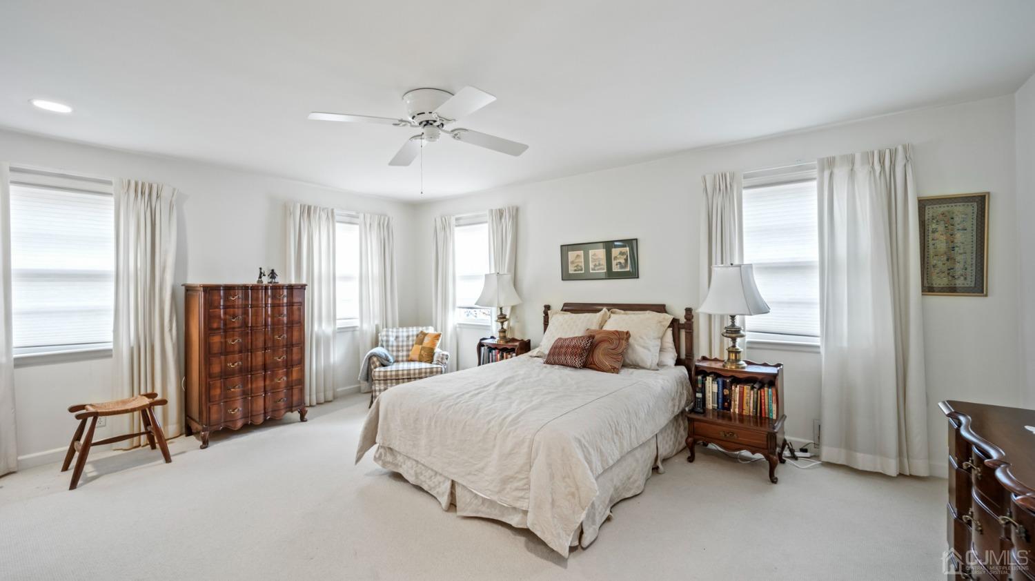 2 Beech Lane Edison, NJ 08820 - Photo 10 of 33 a bedroom with a bed and a chandelier