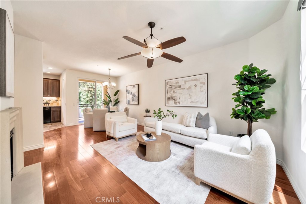 24 Marcilla Ladera Ranch, CA 92694 - Photo 1 of 1 a living room with furniture potted plant and a fireplace