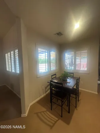 a workspace with furniture and window