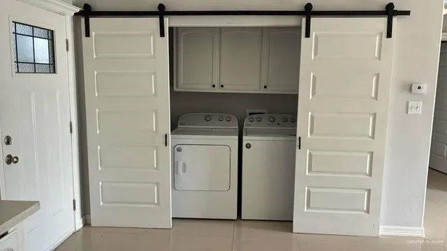 a utility room with cabinets
