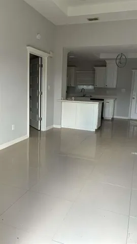 a view of a kitchen with a sink and a microwave