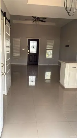 a view of a livingroom with furniture and windows