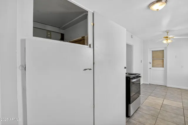 a view of an empty room with a window