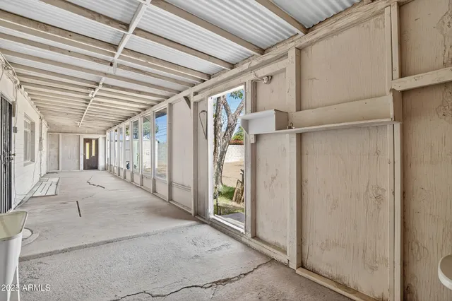 a view of a hallway with a chandelier