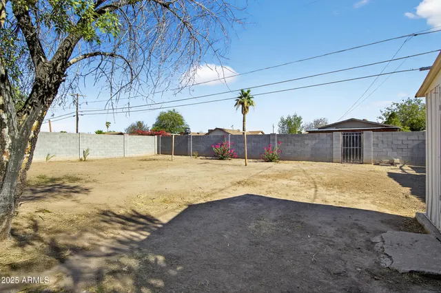 a front view of a house with a garden and balcony