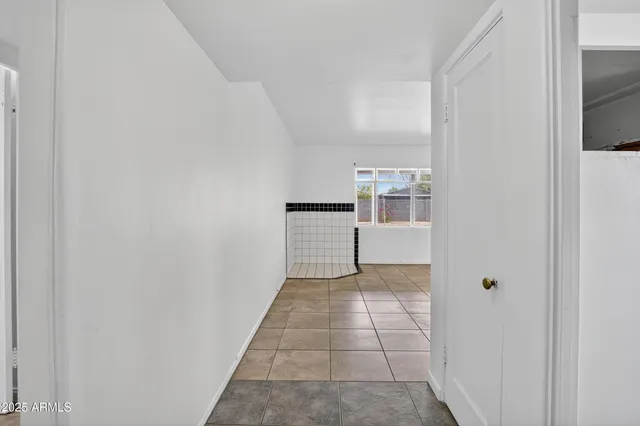 a view of kitchen with granite countertop cabinets and sink