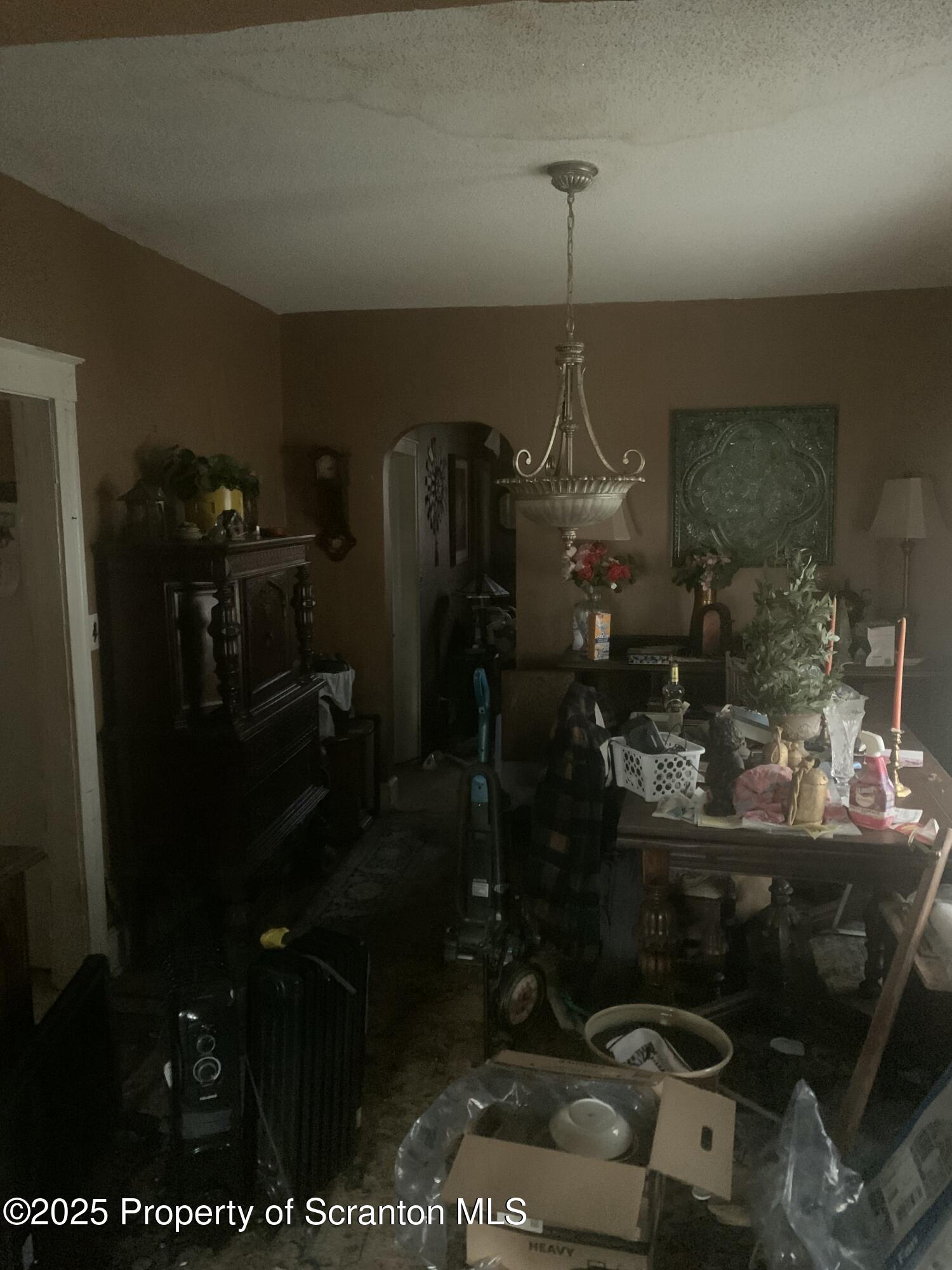 1018 Madison Avenue Scranton, PA 18510 - Photo 6 of 13 a room with water heater and wooden walls