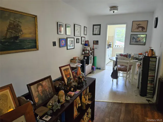 a view of a livingroom with furniture and a flat screen tv