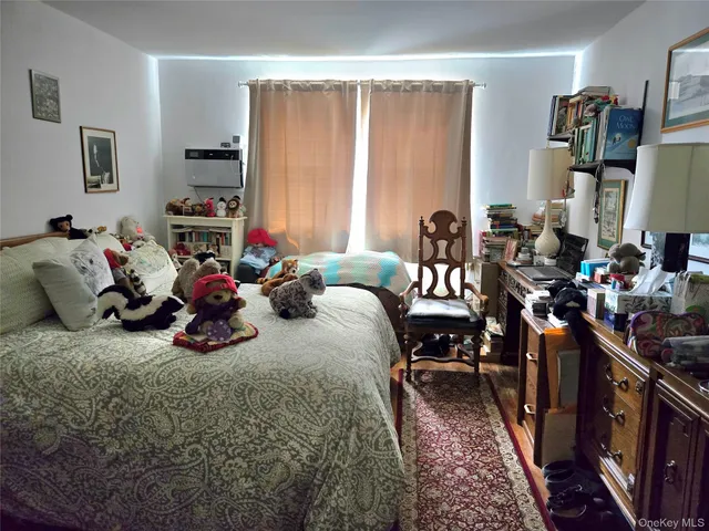 a bed room with a bed and a chair