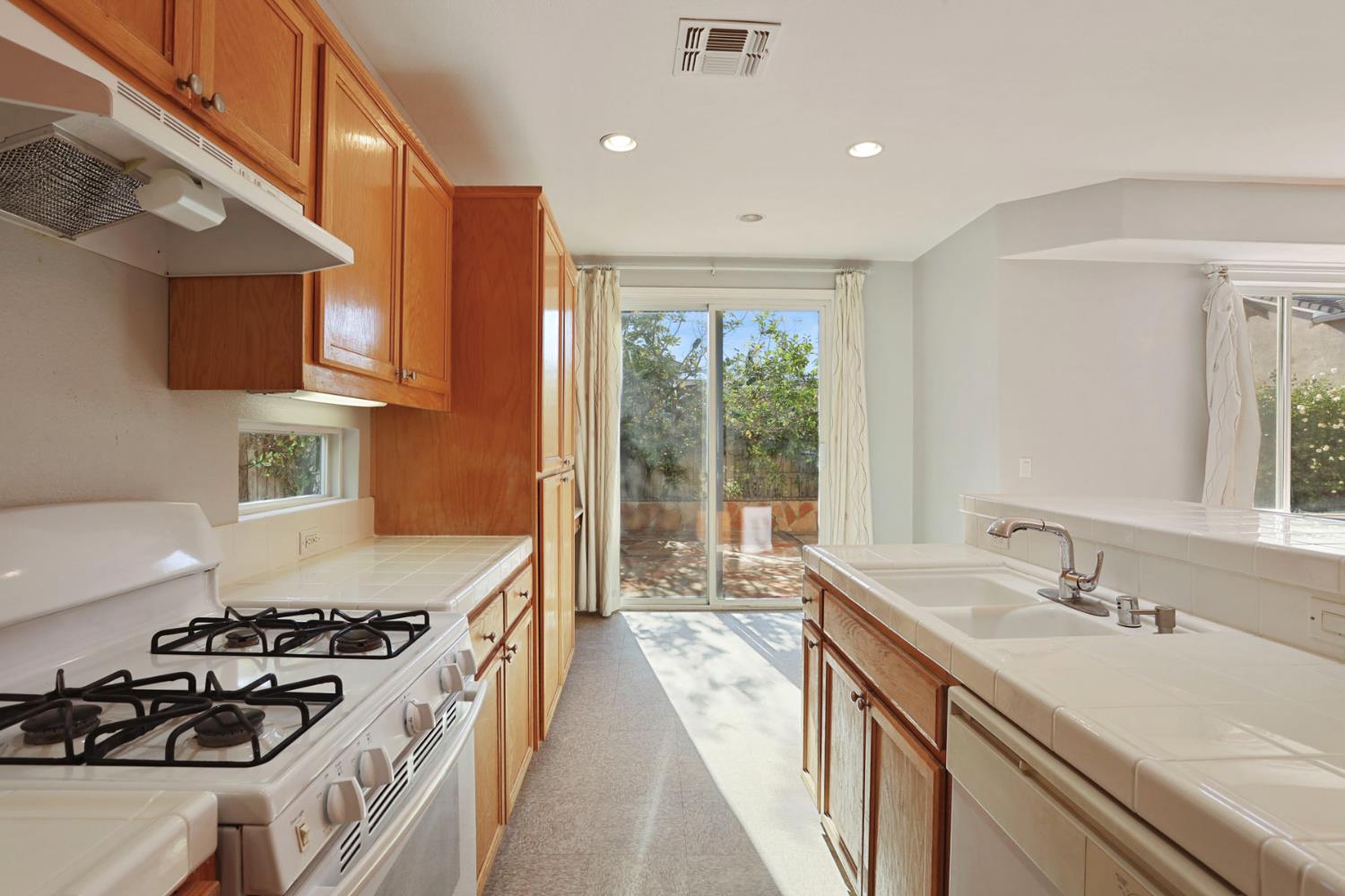 2902 Campbell Lane Tracy, CA 95377 - Photo 12 of 29 a kitchen with a sink stove and cabinets