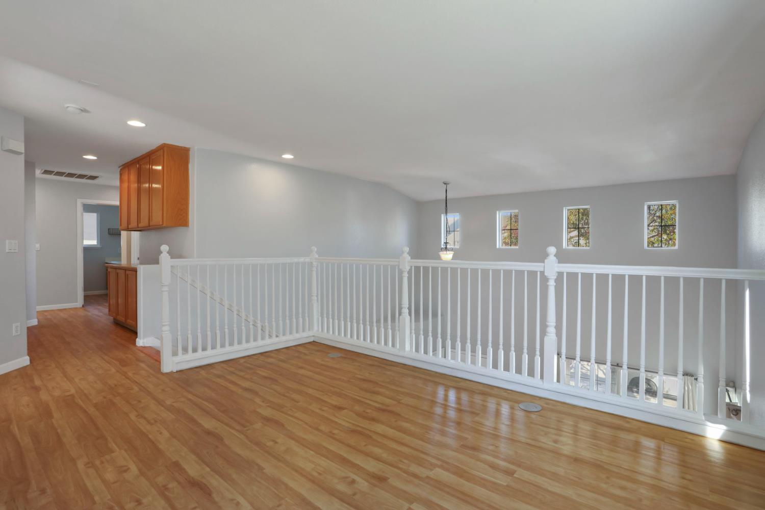 2902 Campbell Lane Tracy, CA 95377 - Photo 17 of 29 a view of a hallway with wooden floor
