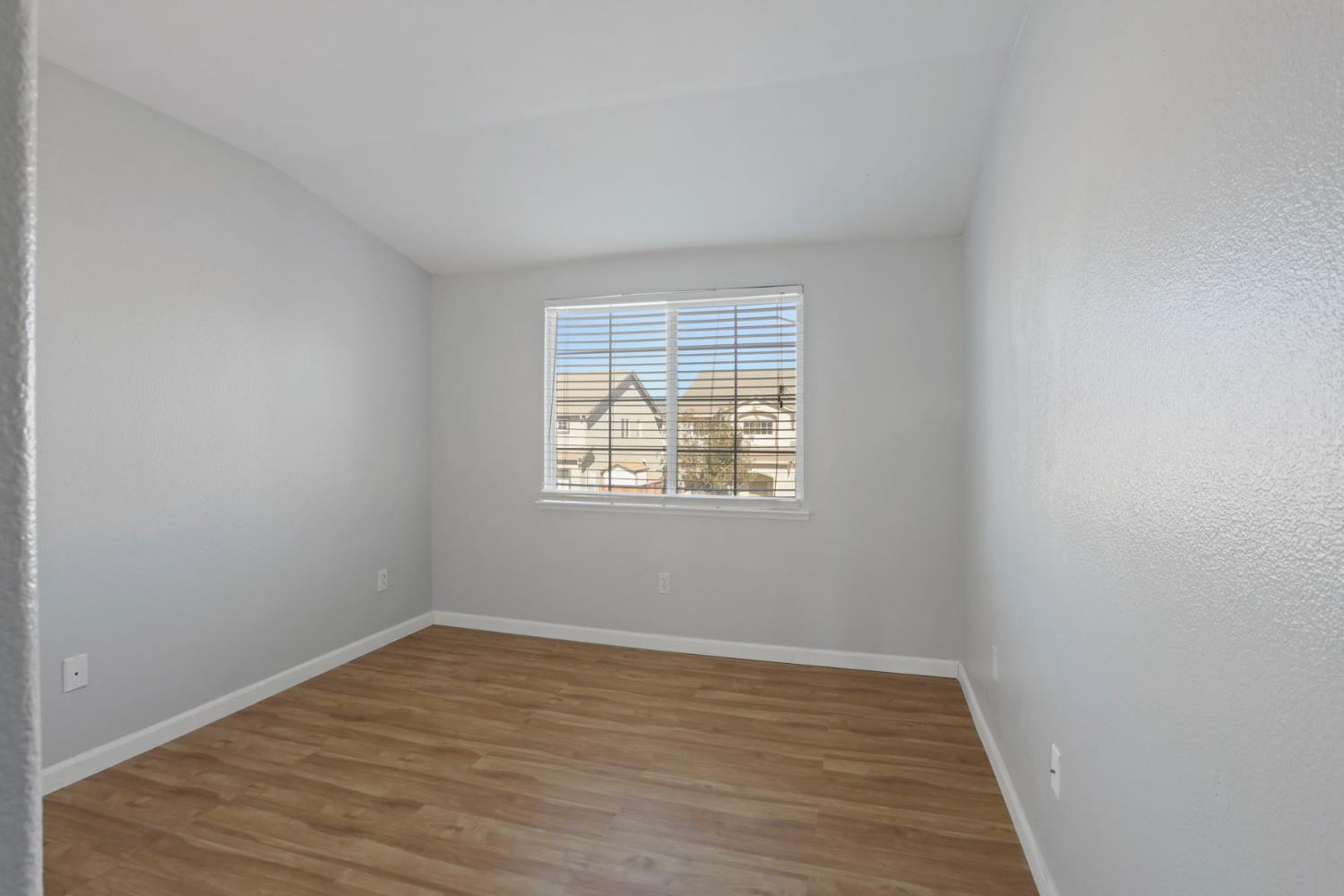 2902 Campbell Lane Tracy, CA 95377 - Photo 23 of 29 wooden floor in an empty room with a window