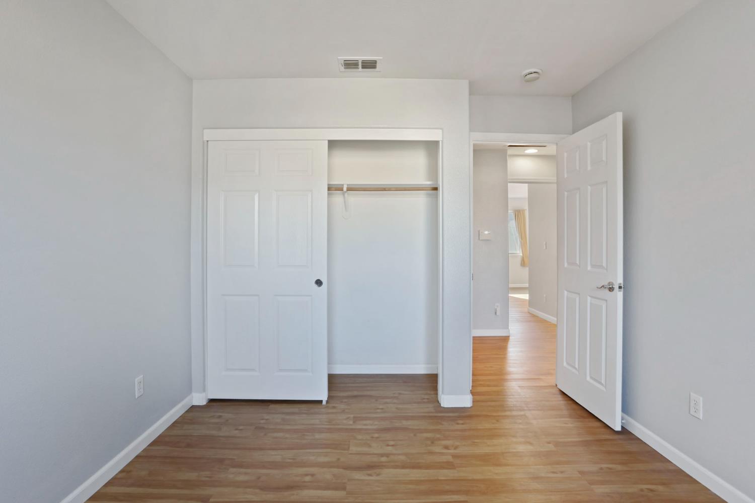 2902 Campbell Lane Tracy, CA 95377 - Photo 24 of 29 a view of an empty room with wooden floor and closet