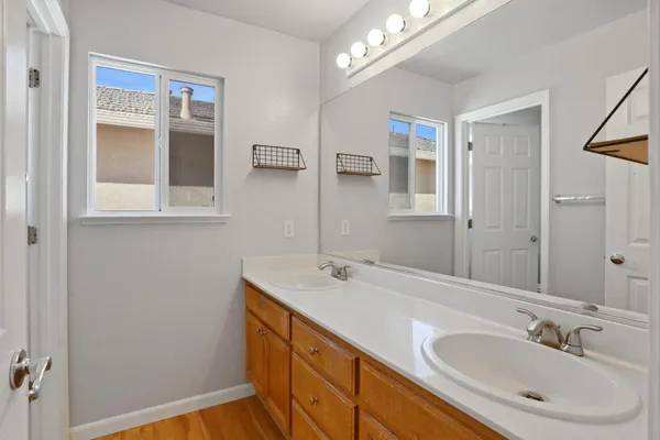 a bathroom with a sink a vanity and a mirror