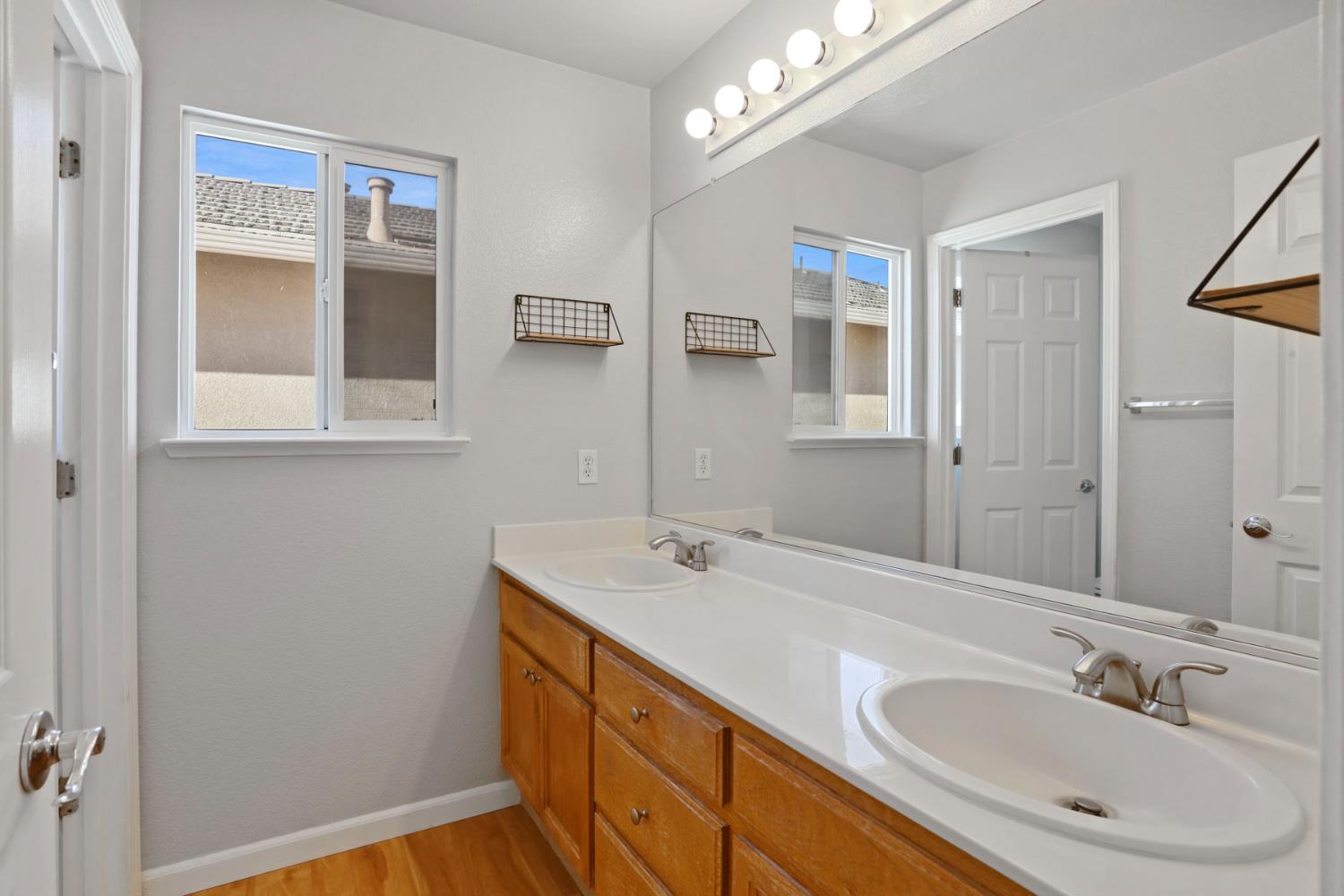 2902 Campbell Lane Tracy, CA 95377 - Photo 25 of 29 a bathroom with a sink a vanity and a mirror