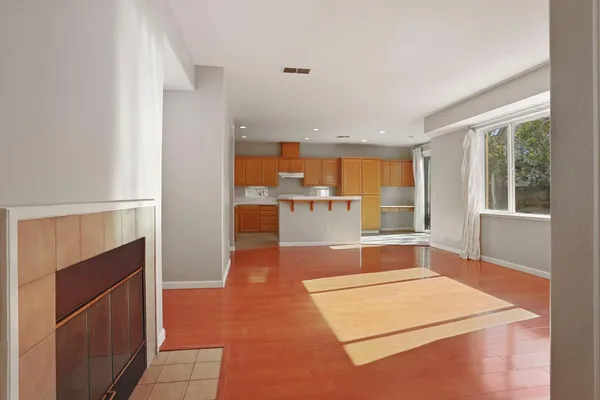 a room with pool table and glass windows