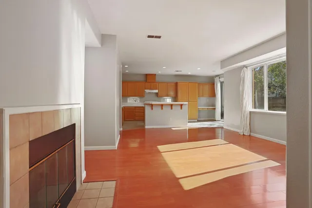a room with pool table and glass windows