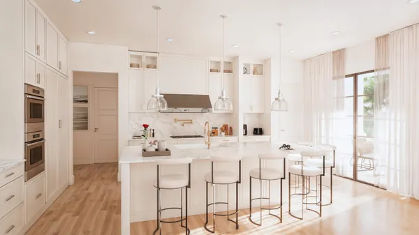 a kitchen with stainless steel appliances kitchen island granite countertop a stove a sink a dining table and chairs