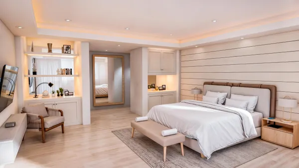 a bedroom with a bed and a couch