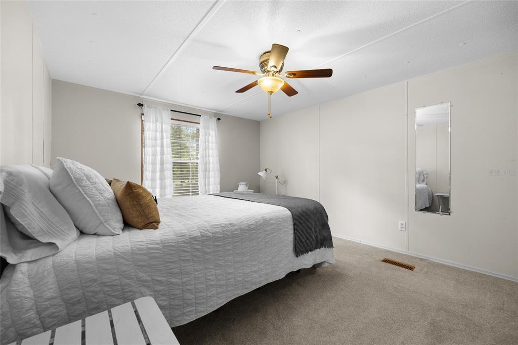 3639 Northeast 80th Avenue High Springs, FL 32643 - Photo 18 of 35 a bedroom with a bed and window