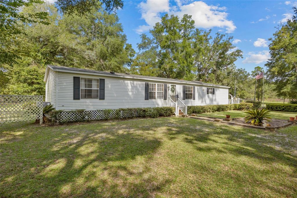 3639 Northeast 80th Avenue High Springs, FL 32643 - Photo 28 of 35 a view of a house with a yard