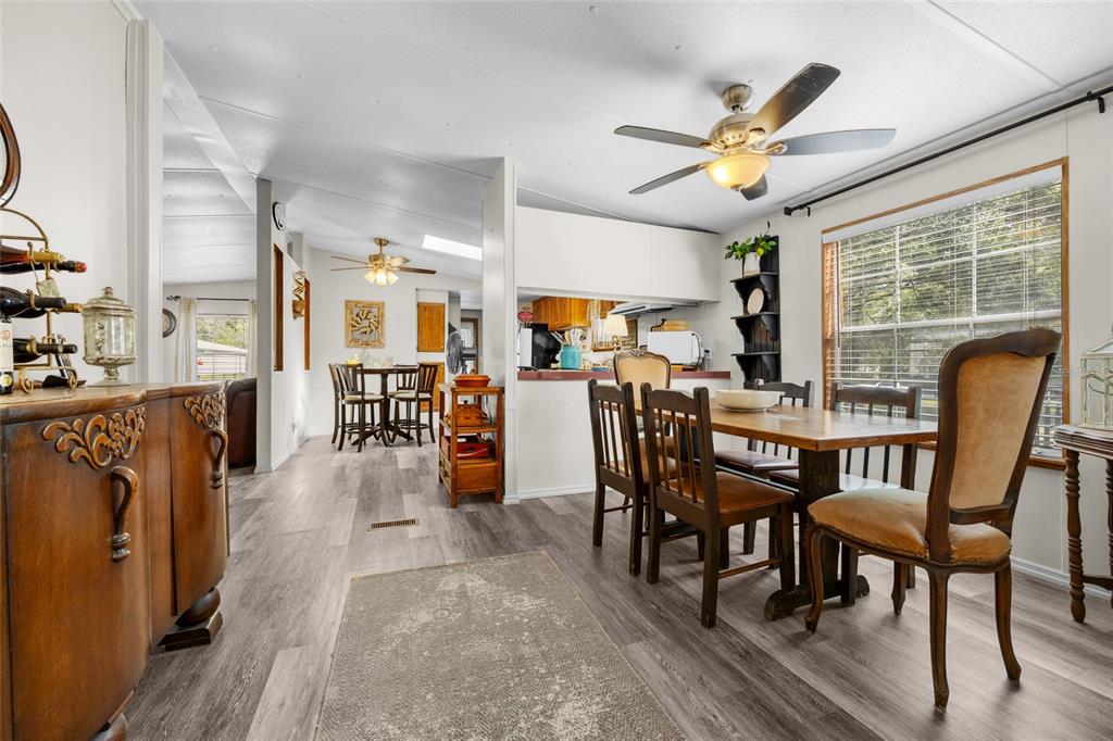 3639 Northeast 80th Avenue High Springs, FL 32643 - Photo 9 of 35 a view of a dining room with furniture window and wooden floor