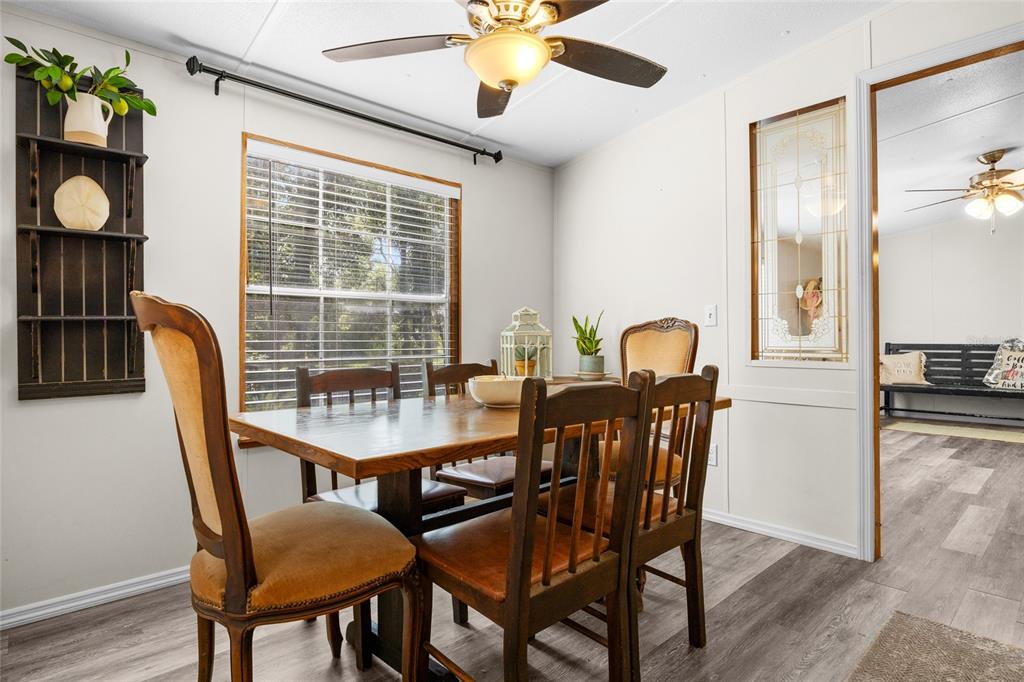 3639 Northeast 80th Avenue High Springs, FL 32643 - Photo 10 of 35 a view of a dining room with furniture and a window