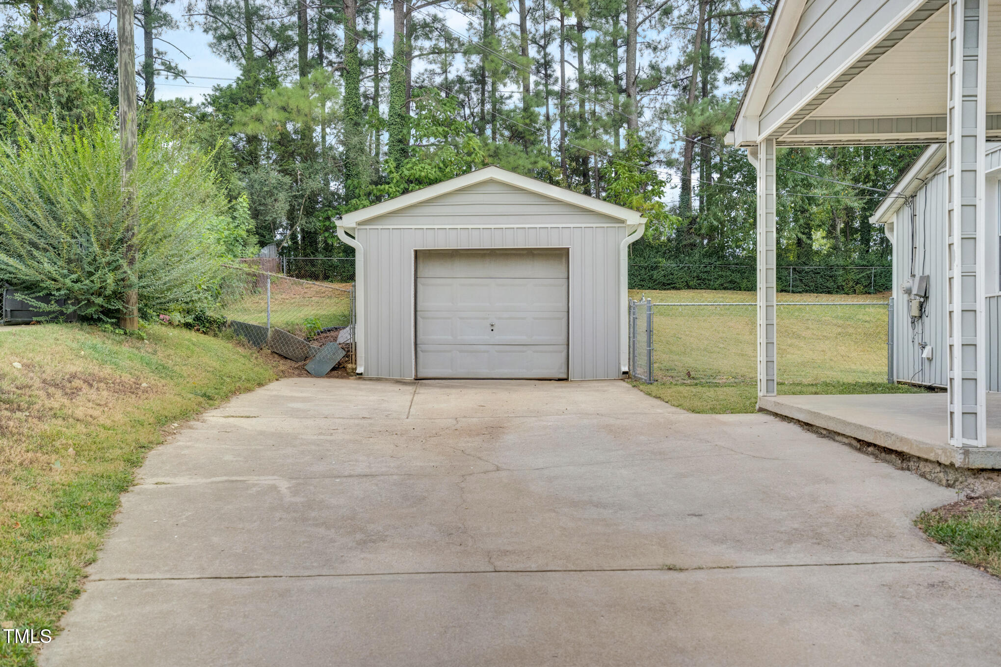 3312 Apache Drive Raleigh, NC 27609 - Photo 3 of 12 a front view of a house with a yard and garage