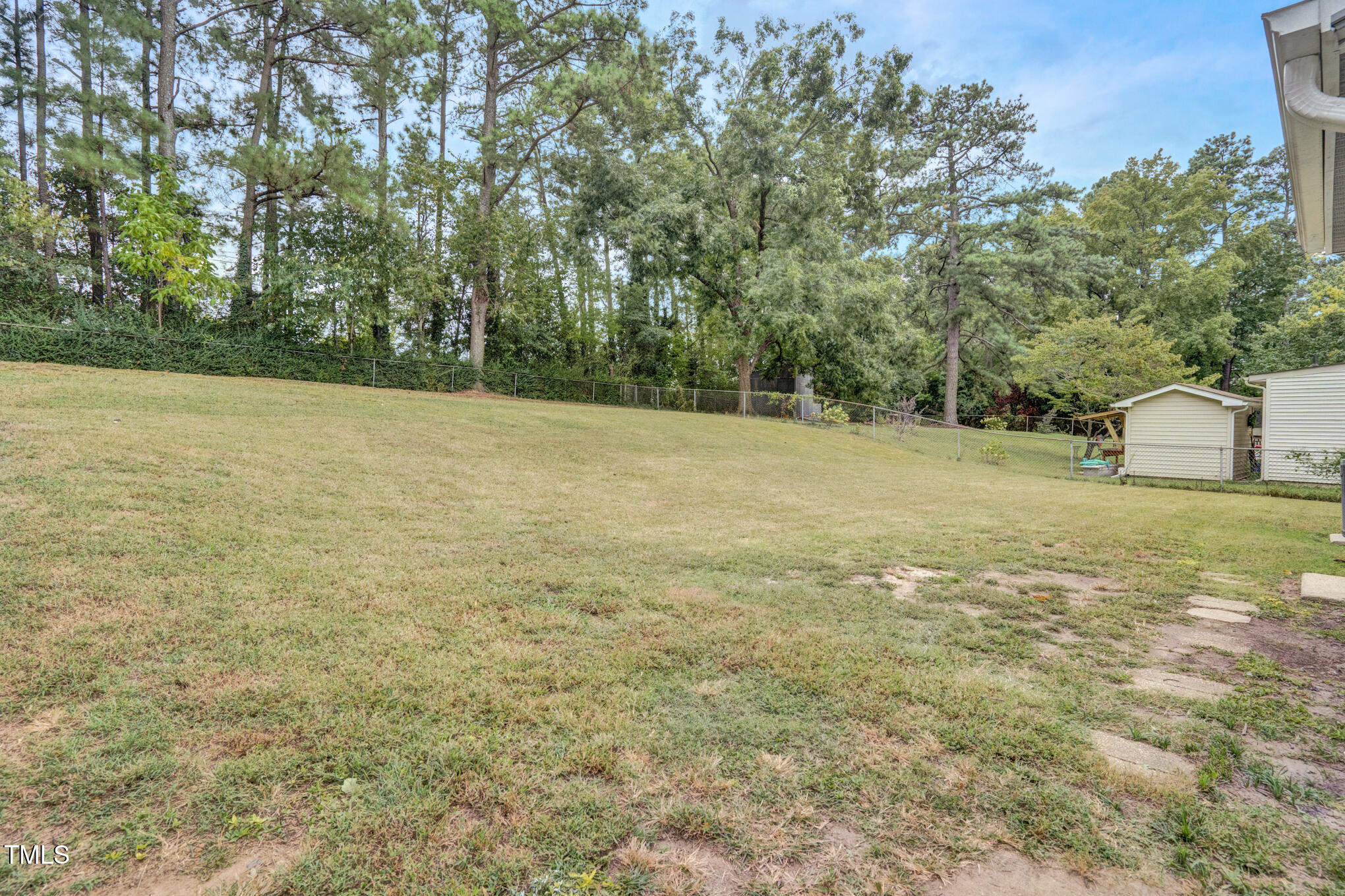 3312 Apache Drive Raleigh, NC 27609 - Photo 5 of 12 a view of a field with trees in the background