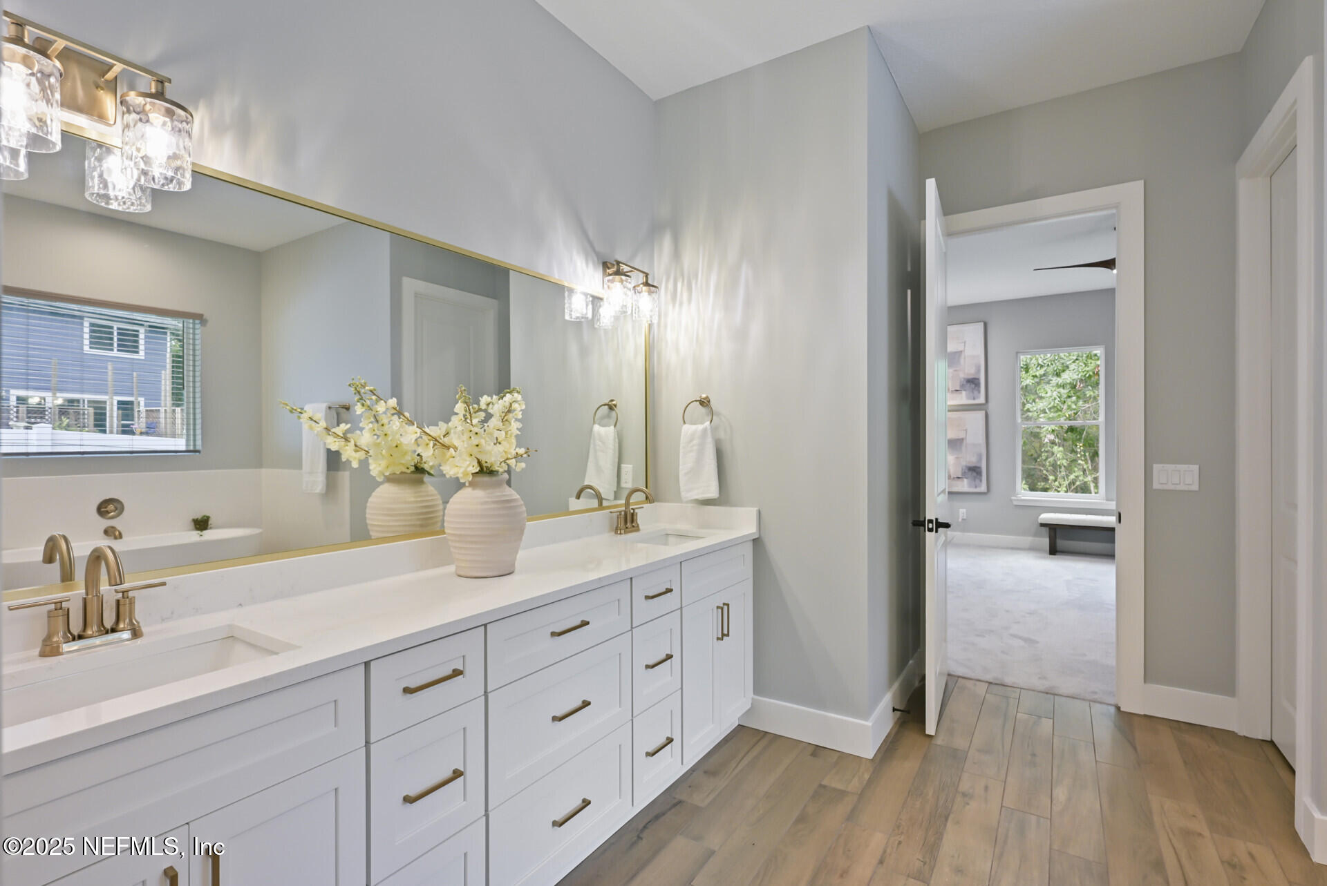 4435 Julington Creek Road Jacksonville, FL 32258 - Photo 25 of 64 a bathroom with a double vanity sink and a mirror