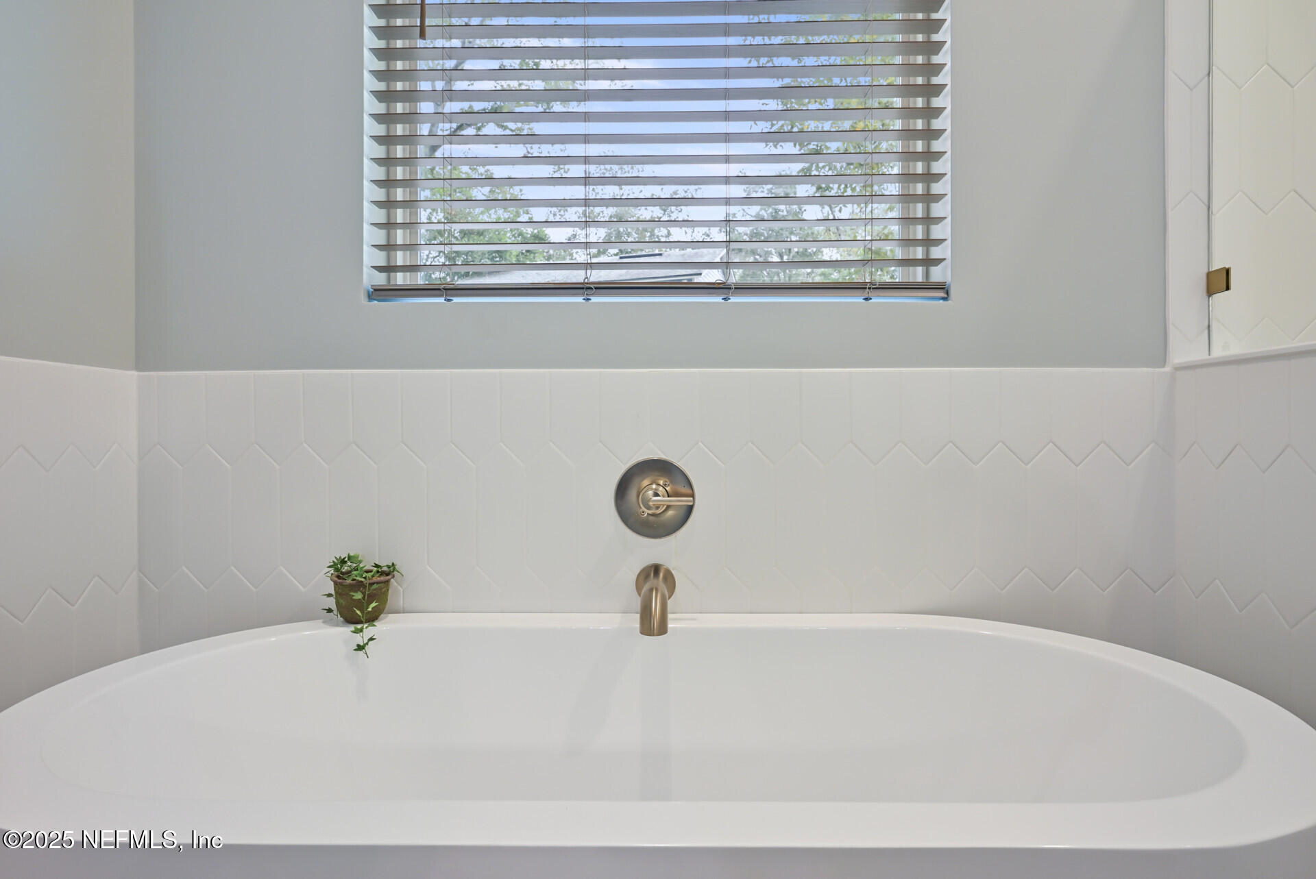 4435 Julington Creek Road Jacksonville, FL 32258 - Photo 29 of 64 a white bath tub sitting in a bathroom