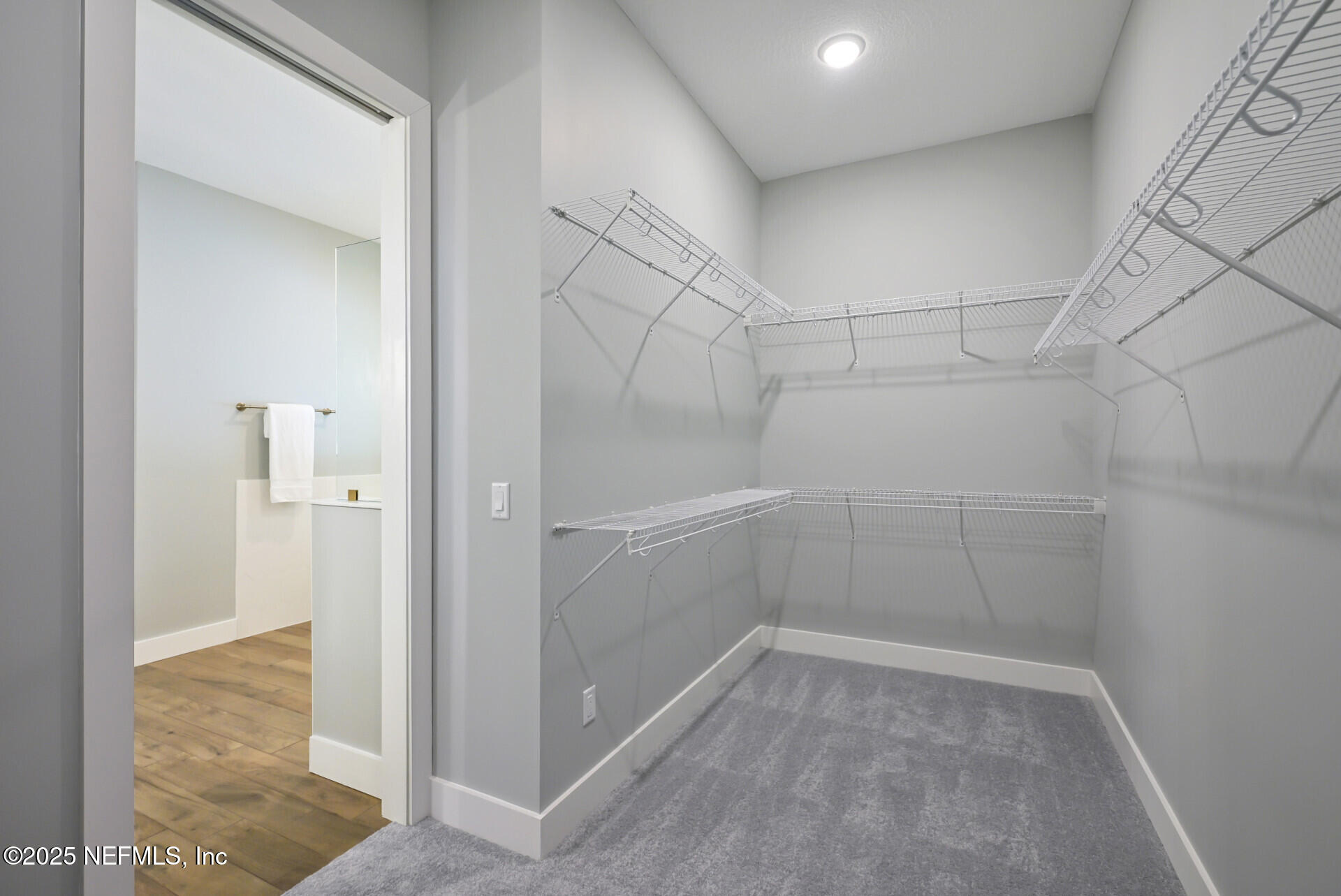 4435 Julington Creek Road Jacksonville, FL 32258 - Photo 31 of 64 a view of a room with racks on the wall