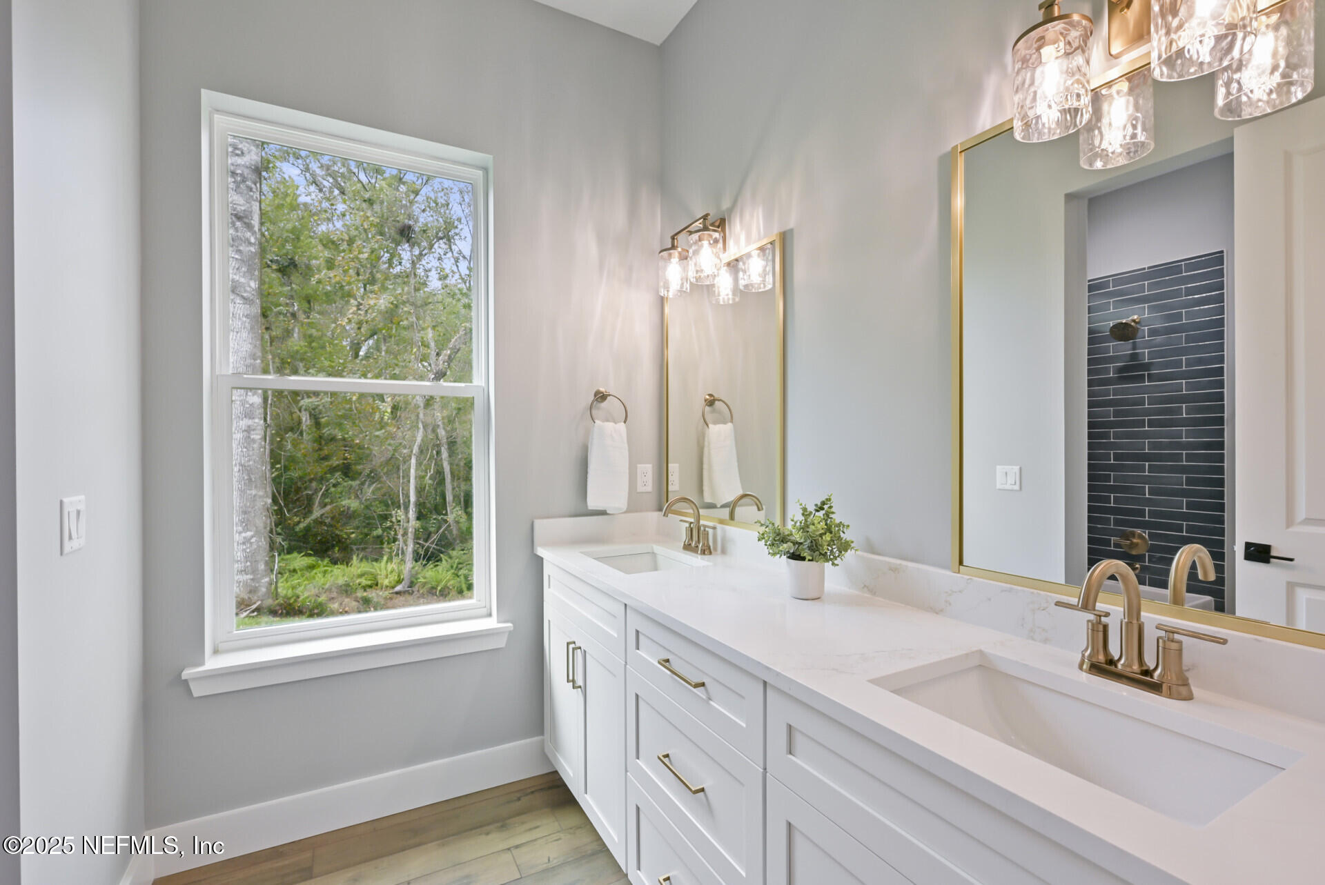 4435 Julington Creek Road Jacksonville, FL 32258 - Photo 34 of 64 a bathroom with a double vanity sink and a mirror