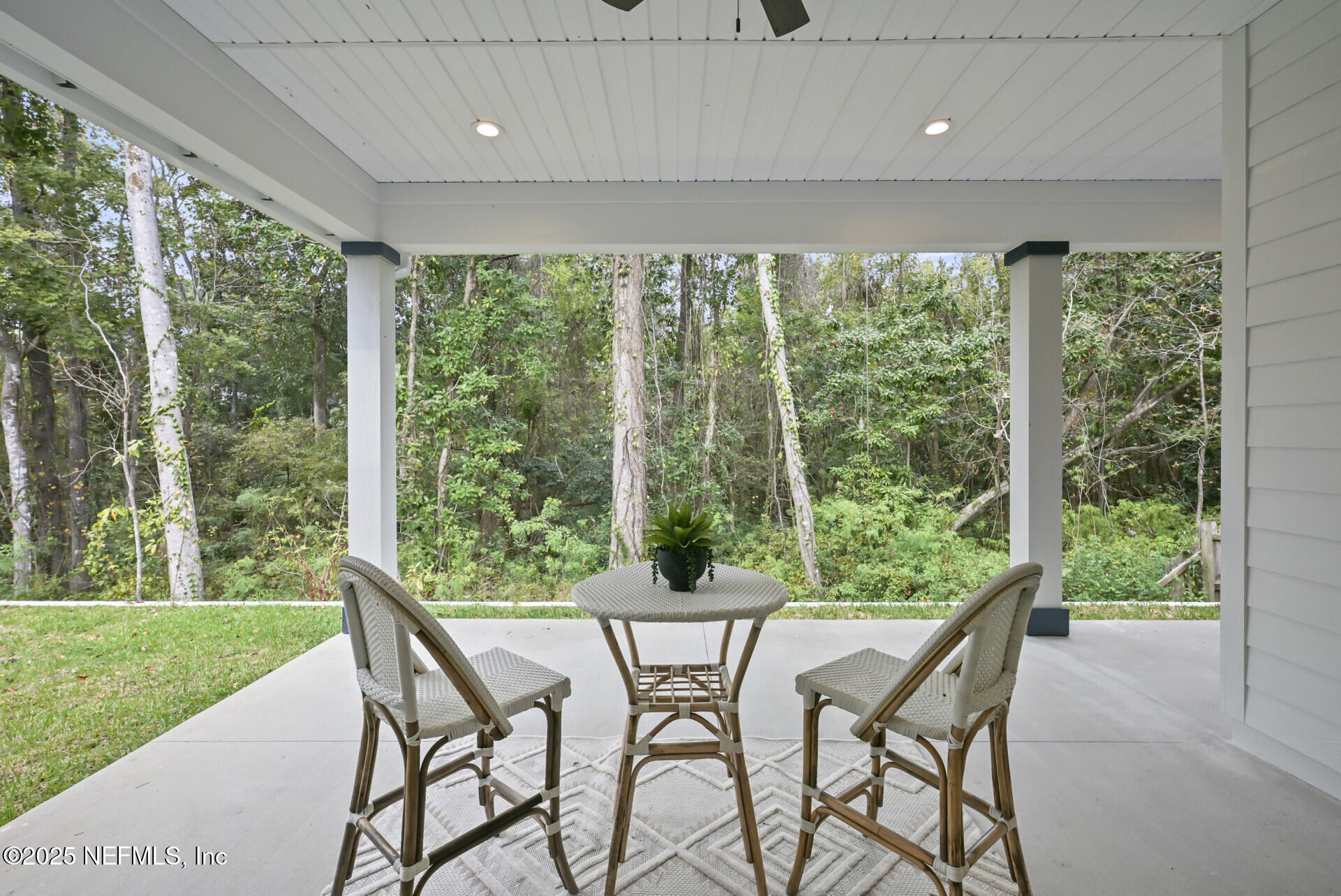 4435 Julington Creek Road Jacksonville, FL 32258 - Photo 4 of 64 a patio with yard glass top table and chairs