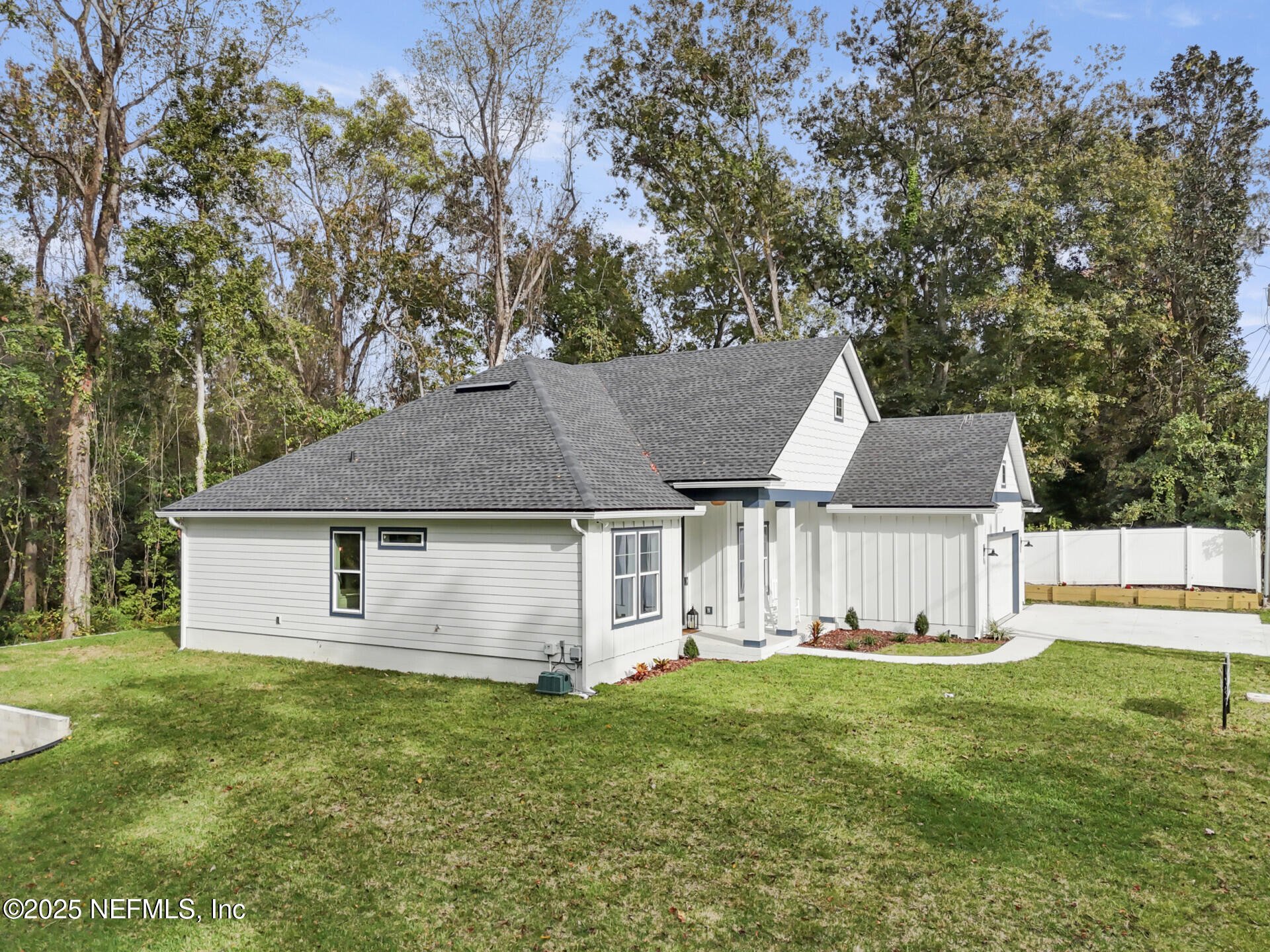 4435 Julington Creek Road Jacksonville, FL 32258 - Photo 45 of 64 a view of a house with a big yard and large tree