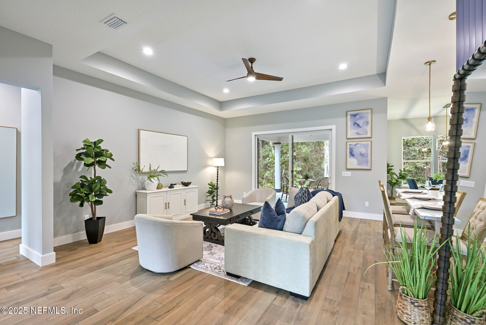 4435 Julington Creek Road Jacksonville, FL 32258 - Photo 9 of 64 a living room with furniture potted plant and a window